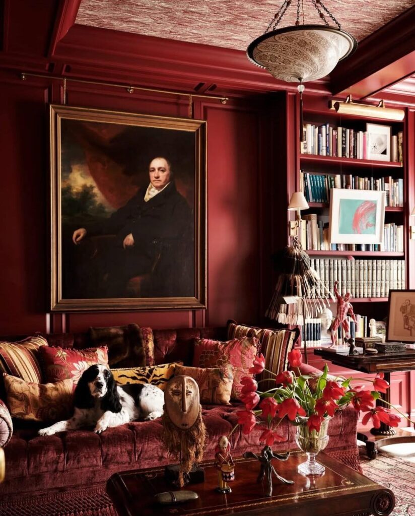 Moody Burgundy Living Room Associated with a Collector