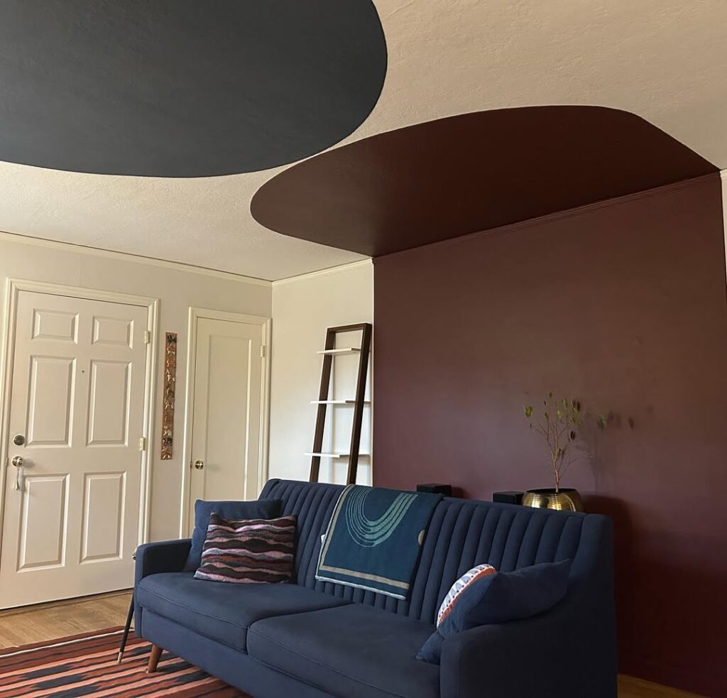 Navy Sofa and Cocoa Wall