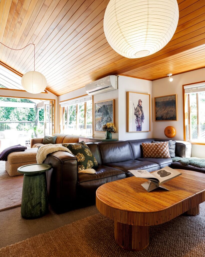 Paper Lantern and Leather Lounge beneath a Teak Ceiling