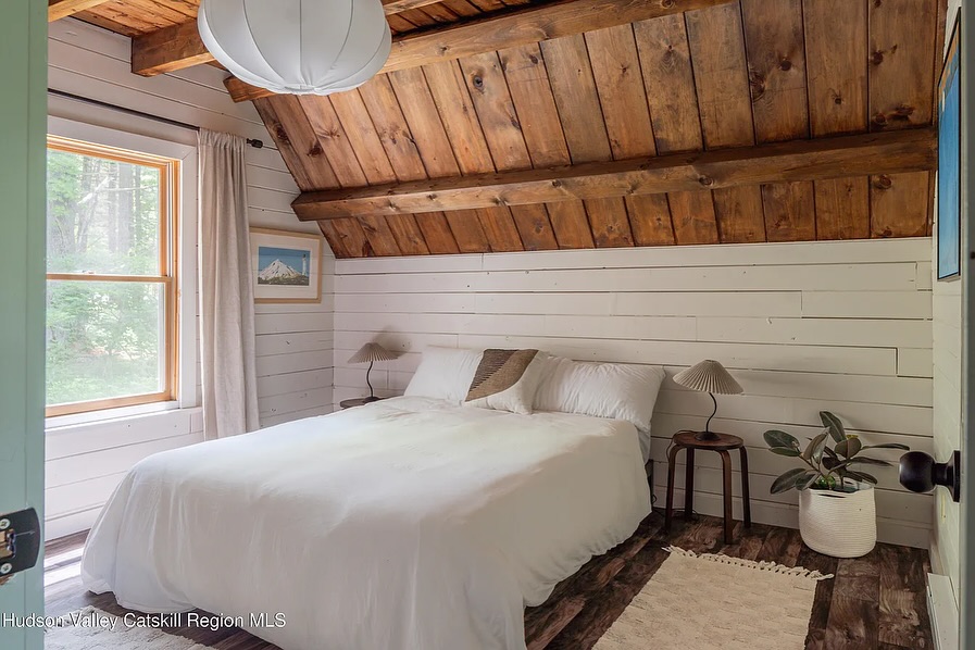 Rustic Cabin Bedroom With Shiplap Ceiling