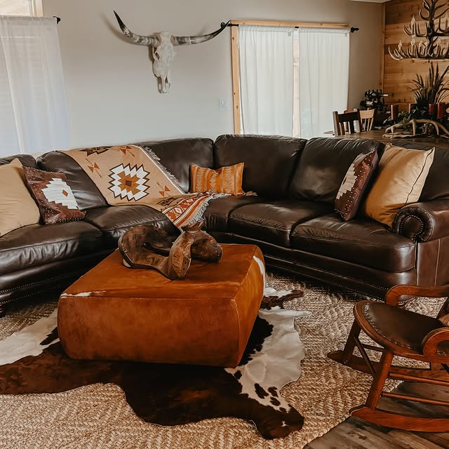 Southwestern textiles sit with a leather lounge in a ranch room