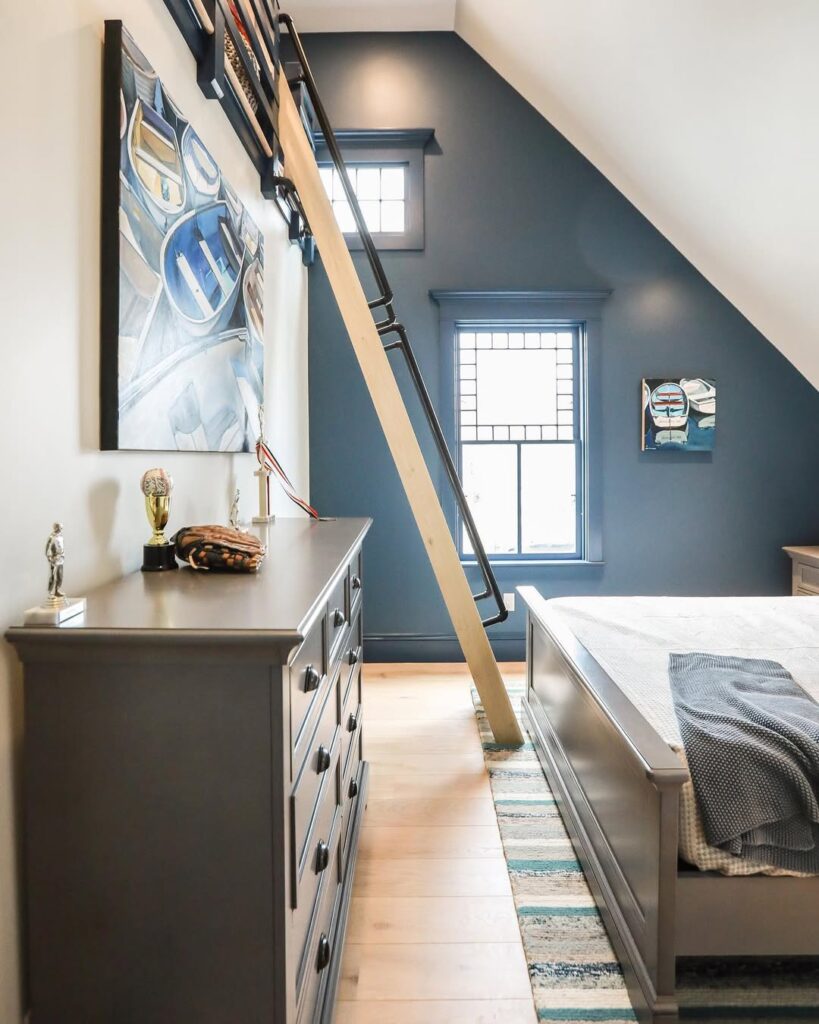 Sport-Inspired Sloped Ceiling Bedroom with Navy Walls