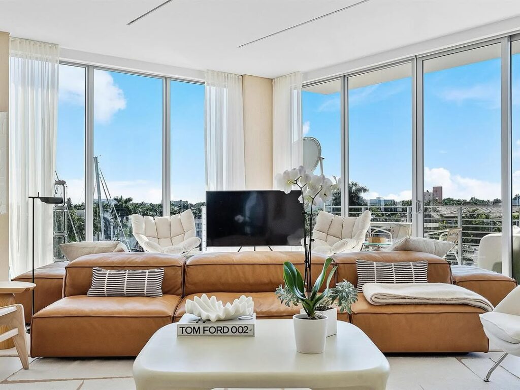 Sunlit Lounge with a Coastal Modern Style and Cognac Leather Couch