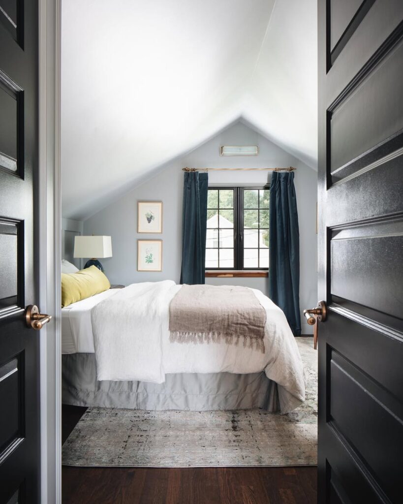 Symmetrical Bedroom Design Beneath a Vaulted Peak