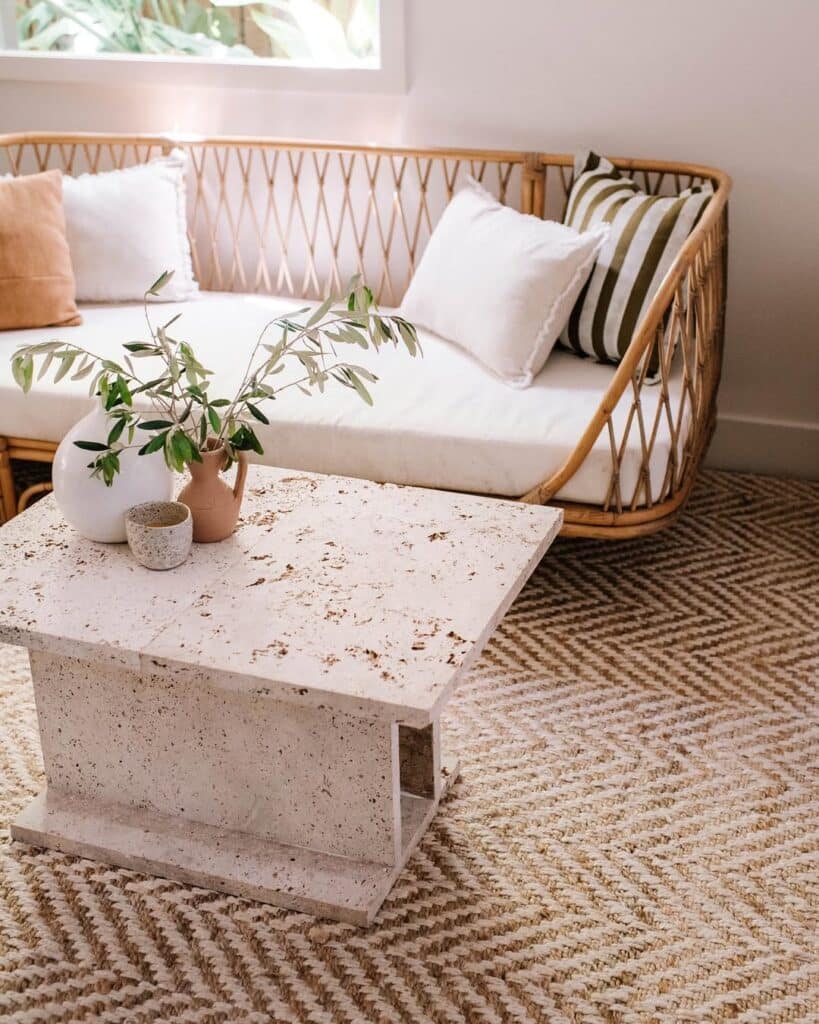 Travertine coffee table with a textured pedestal