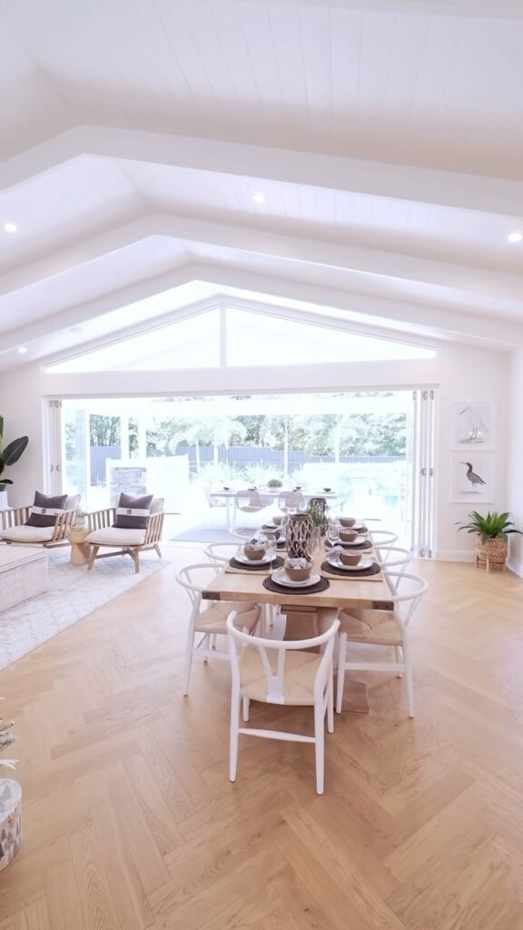 Vaulted White Room with Garden Views and Layered Molding