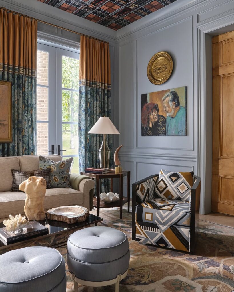 Warm accent in a classic paneled blue living room