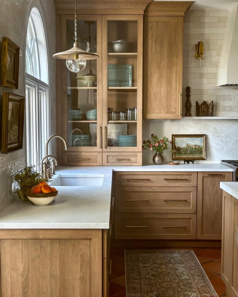 Warm Oak Cabinets with Glass Fronts